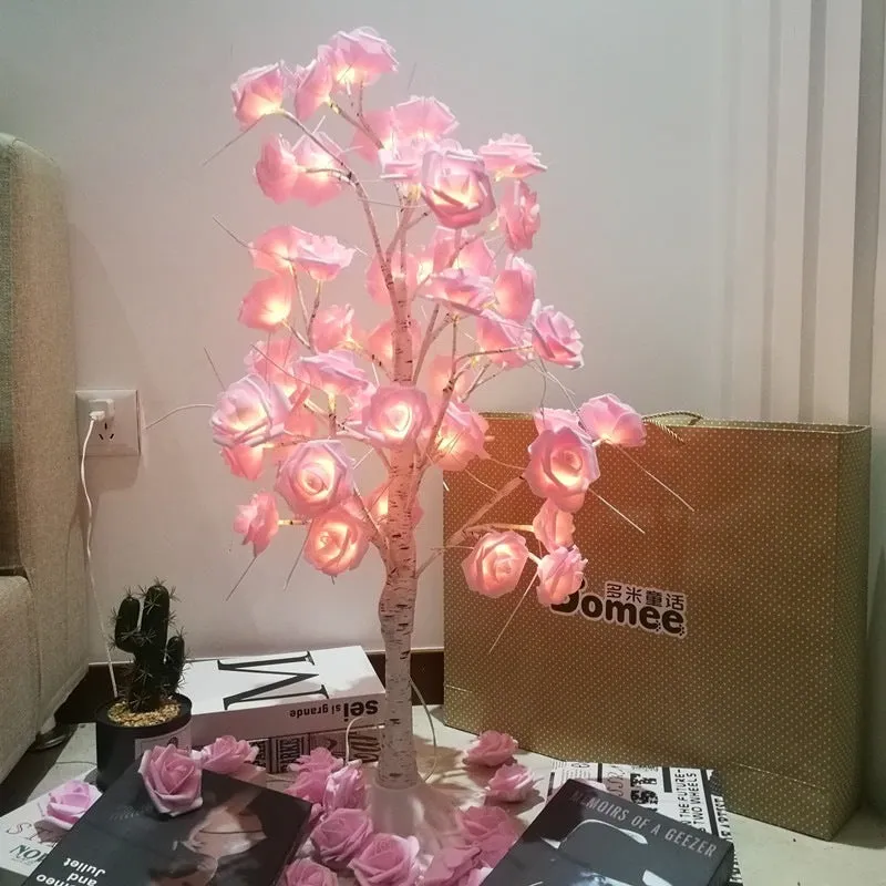60cm Christmas rose shining tree lamp with pink and white flower-shaped PVC lights on a tabletop