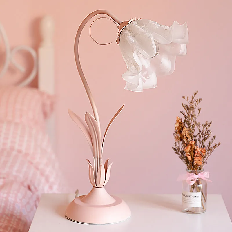 Pink princess room desk lamp with ceramic flowers, glass lampshade, and dimmer switch on a wooden desk