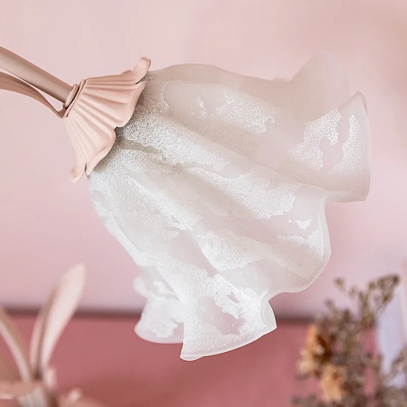 Pink princess room desk lamp with ceramic flowers, glass lampshade, and dimmer switch on a wooden desk