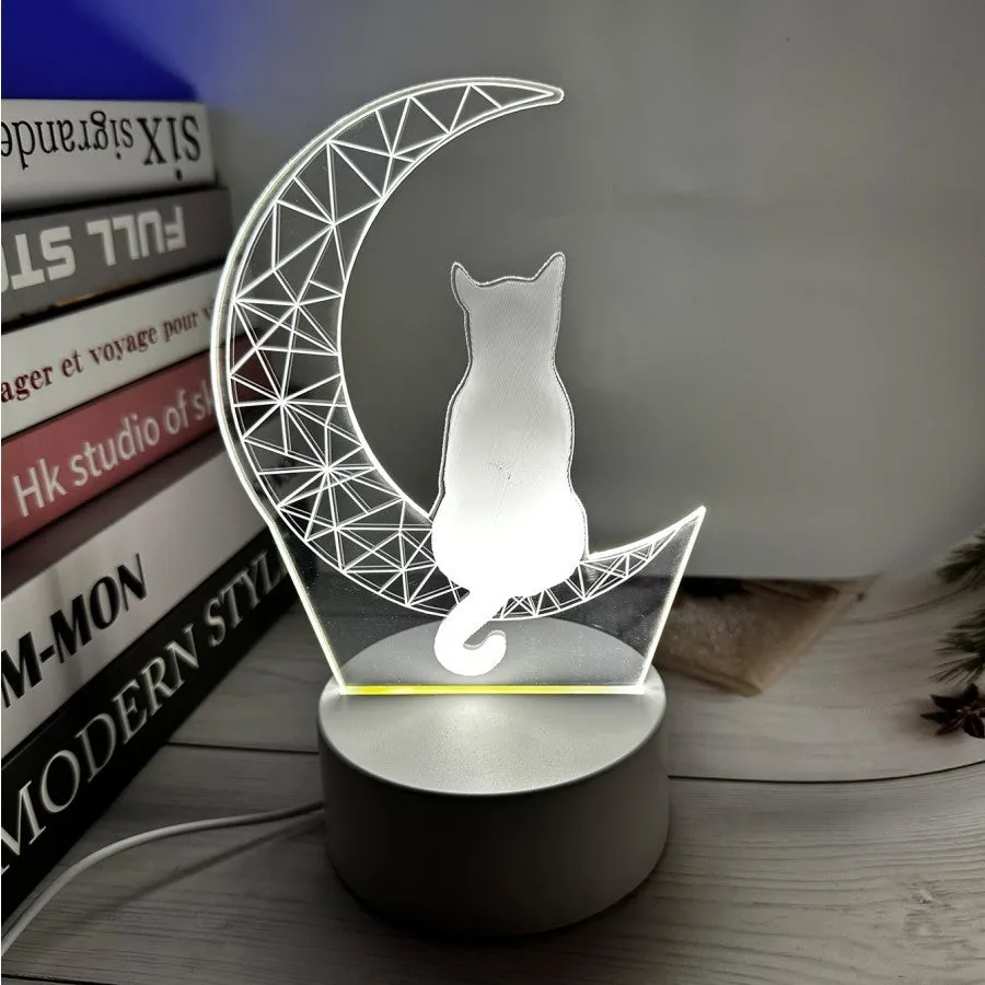 3D LED moon and cat shape acrylic light with black ABS base, USB powered, showing colourful glow