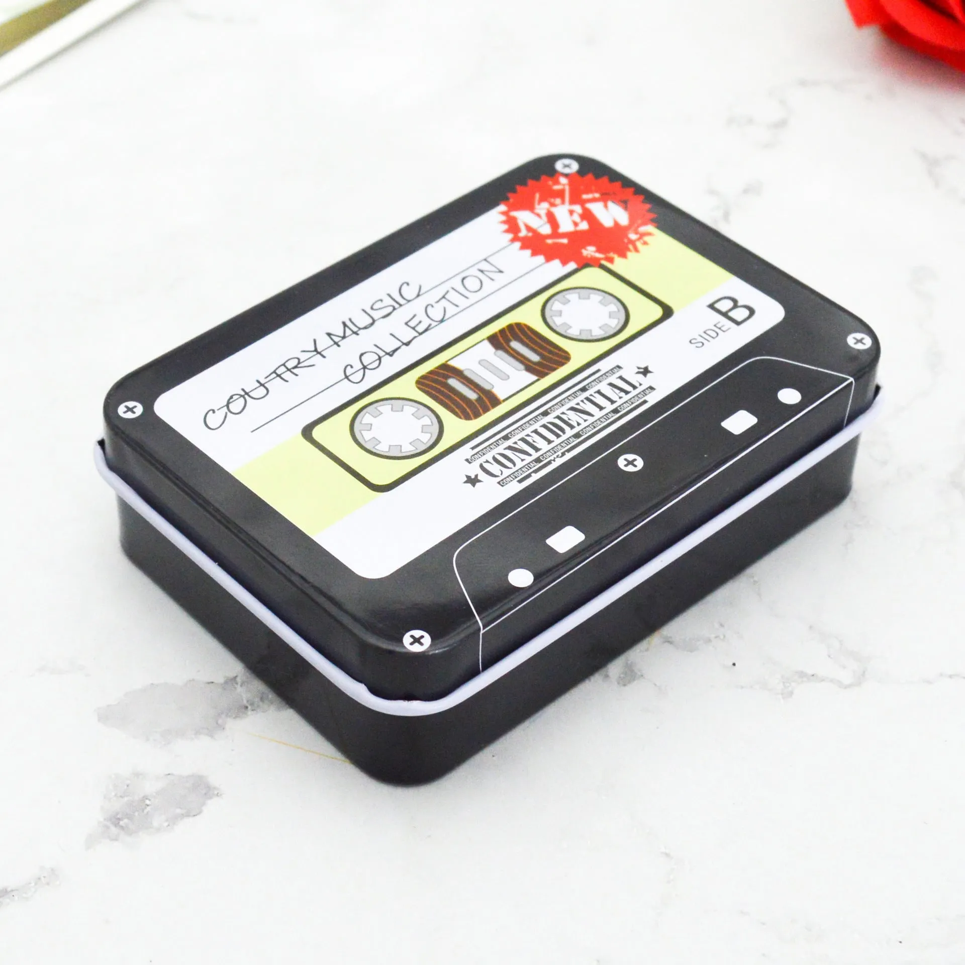 Square tinplate storage box with dimensions 90x65x25mm, available in multiple colours for jewellery and stickers
