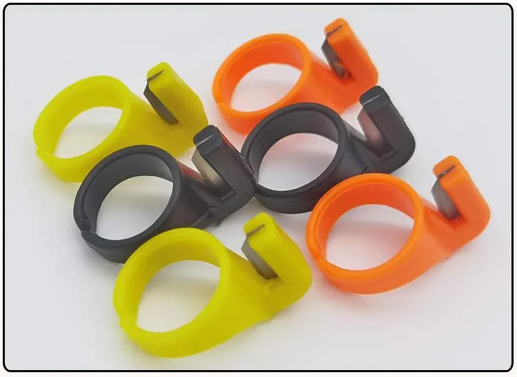 Three seam ripper ring knives in black, orange, and yellow with carbon steel blades and ABS plastic handles