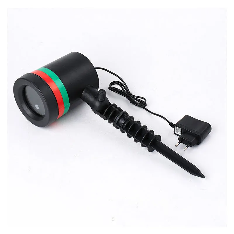 Gypsophila USB laser light Christmas lawn lamp with IP44 waterproof housing, showing red and green laser projection on garden grass at night