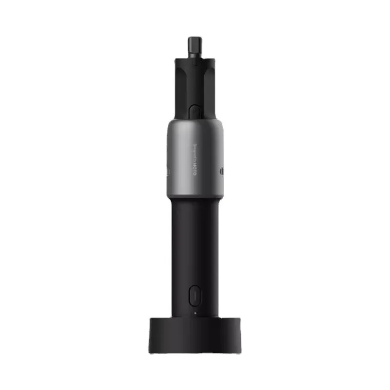 Black hand held rechargeable grinder with USB cable and accessory kit on workbench