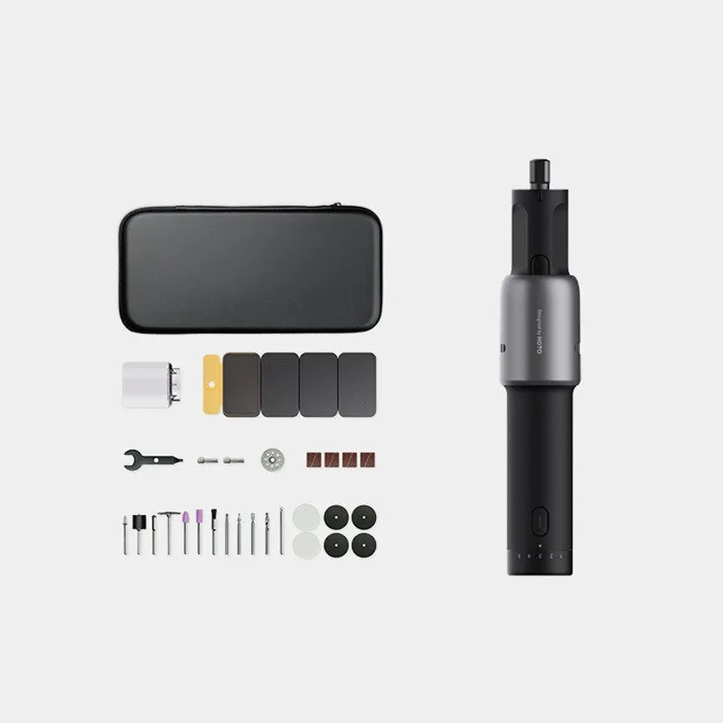 Black hand held rechargeable grinder with USB cable and accessory kit on workbench