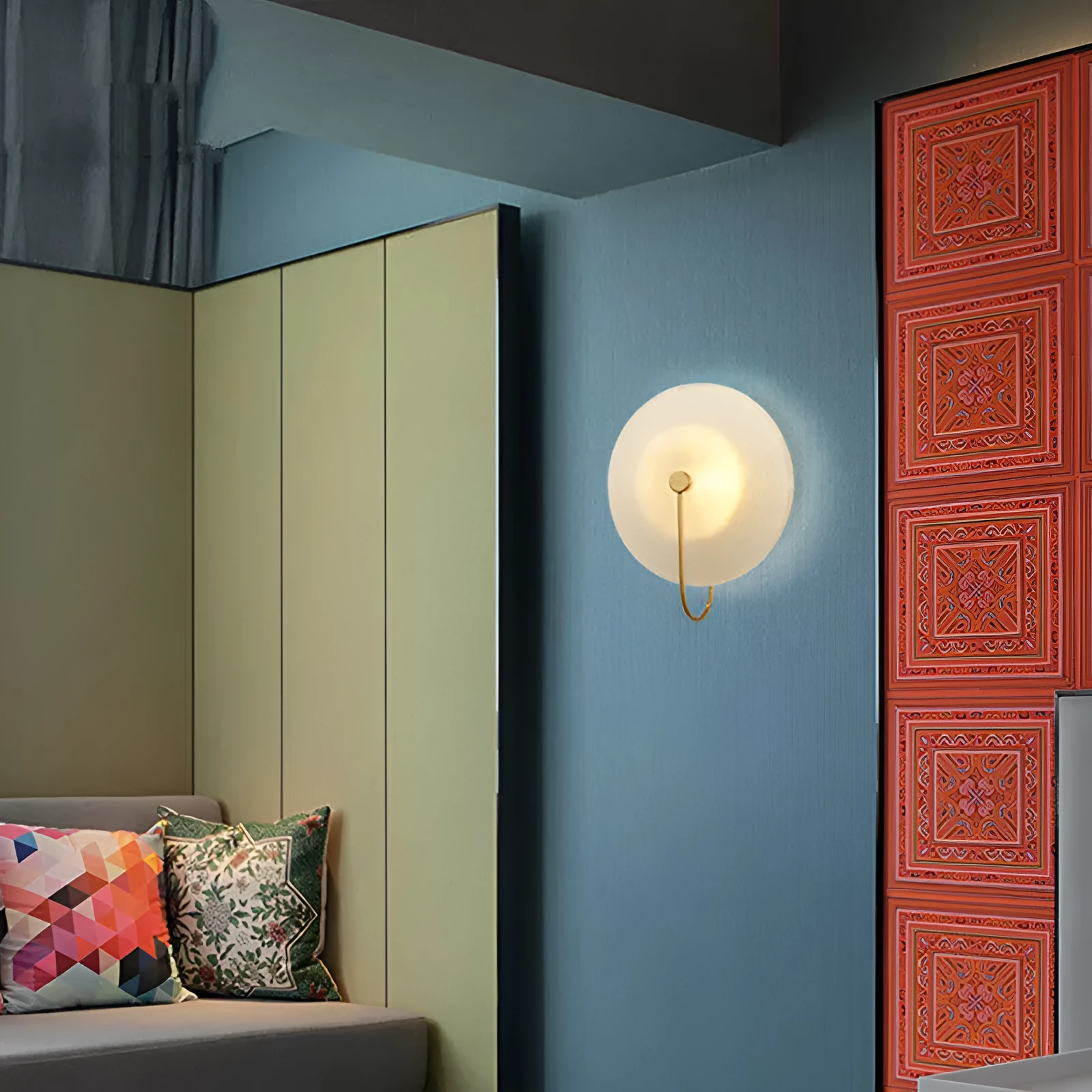 Round glass wall lamp in gold finish mounted on a wall with iron body and clear glass lampshade