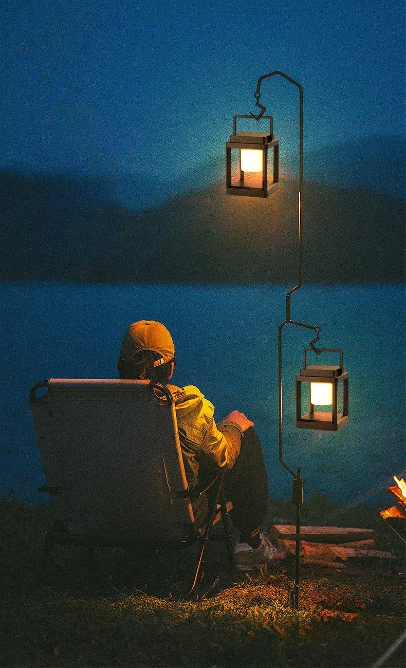 Outdoor USB handheld multifunctional charging ambient light lantern with black cover and white shell