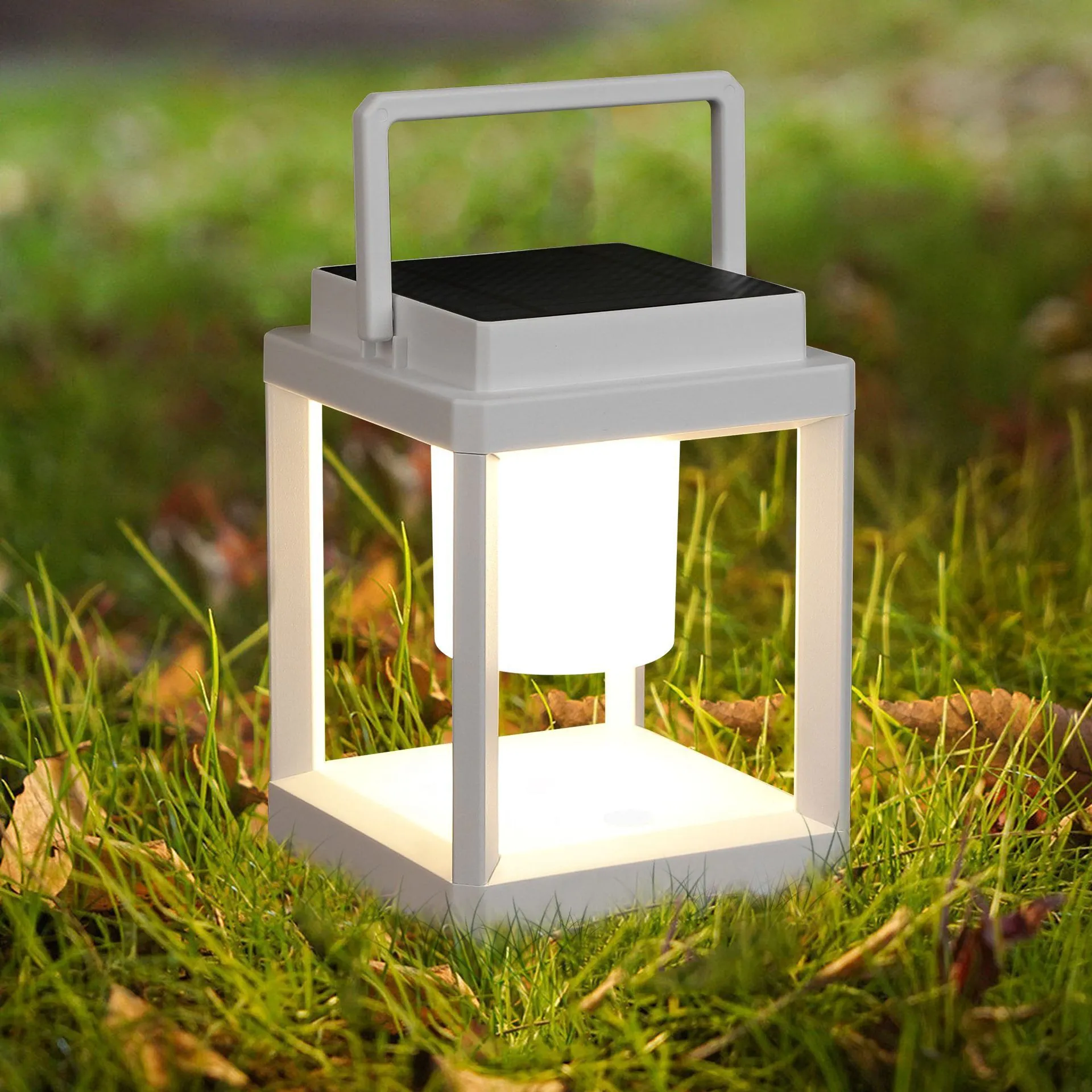 Outdoor USB handheld multifunctional charging ambient light lantern with black cover and white shell