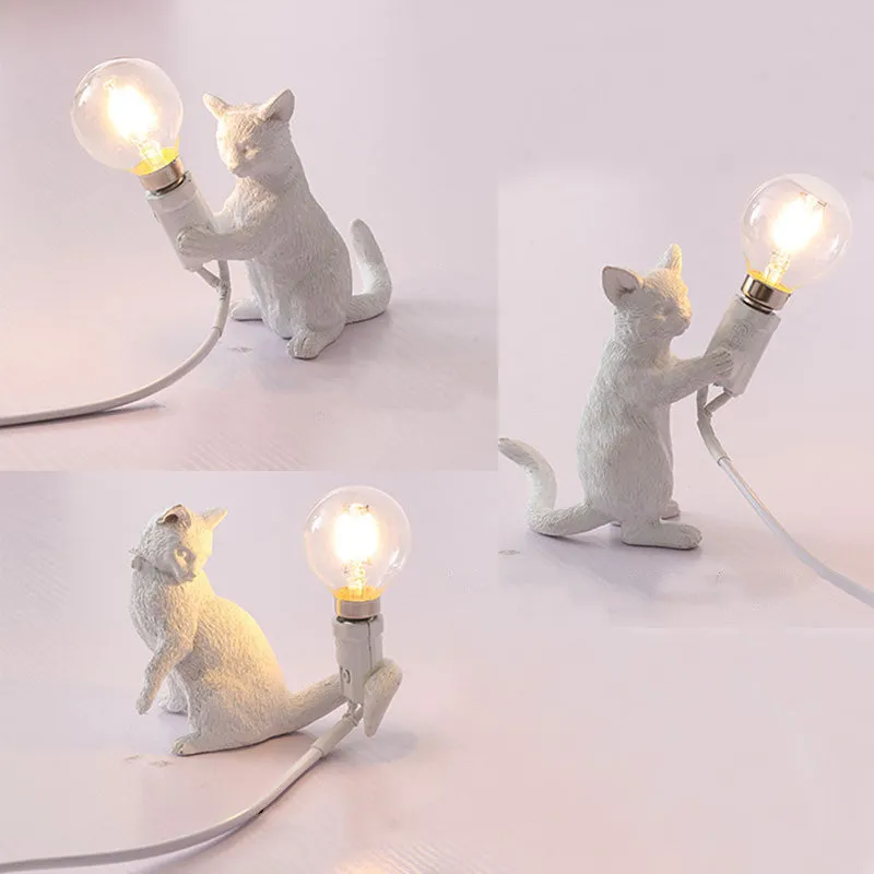 Small resin bedside table lamp in white, measuring 100x60x140mm, on a wooden nightstand
