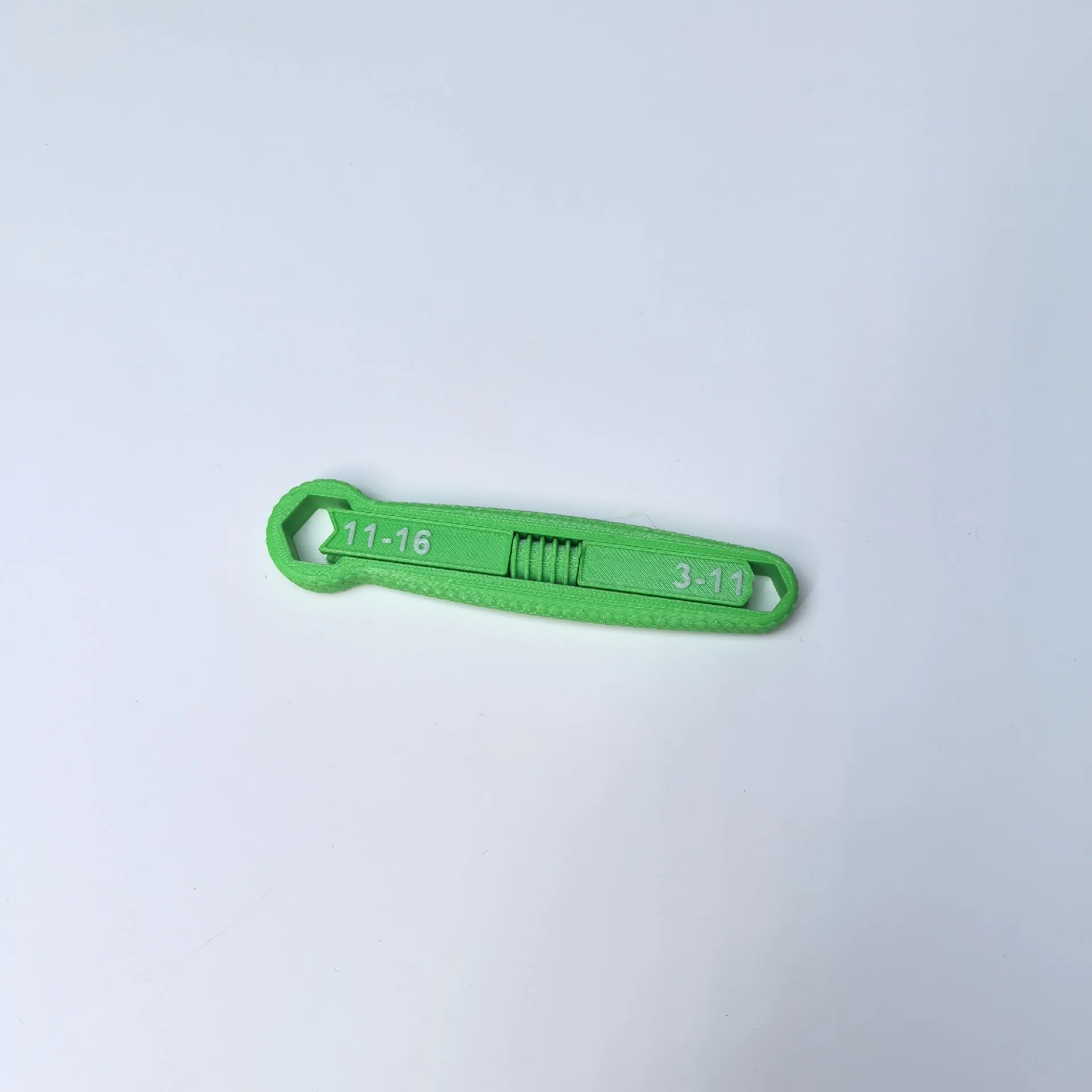 Portable multi-function plastic hand exercise tool in gray for finger strength training