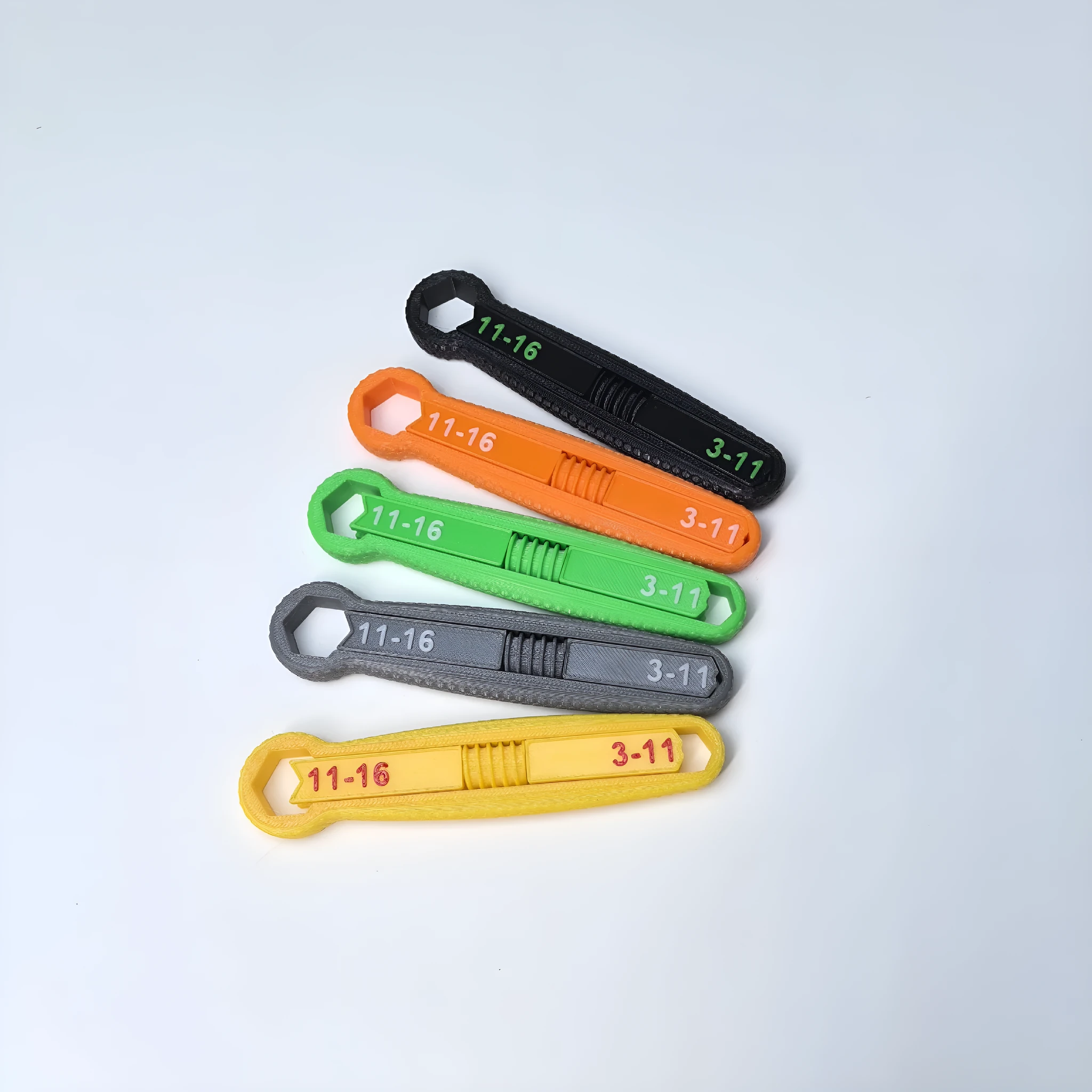 Portable multi-function plastic hand exercise tool in gray for finger strength training