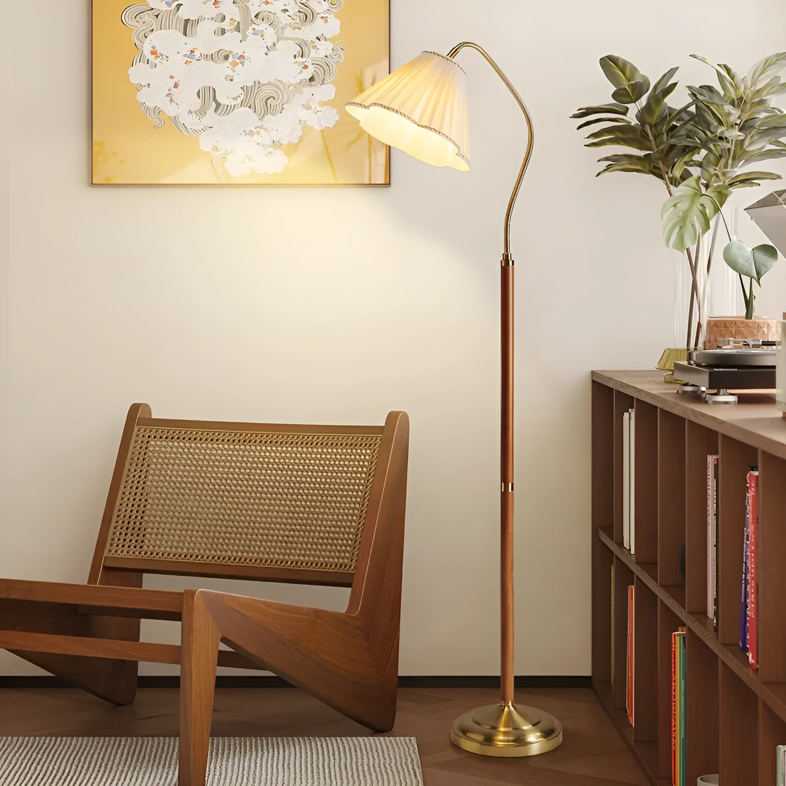 Solid wood floor lamp with fabric shade in walnut colour placed beside a sofa in a living room