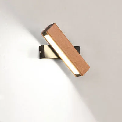Modern wooden LED wall lamp with adjustable light bar in black finish illuminating room