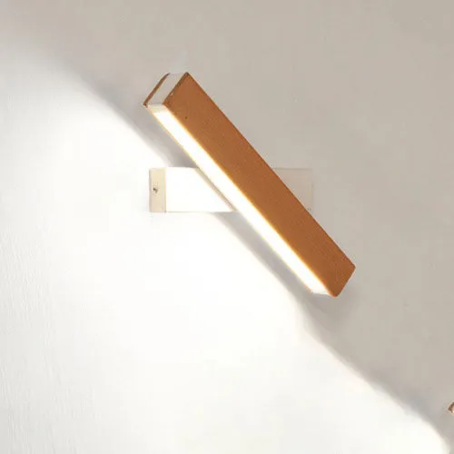 Modern wooden LED wall lamp with adjustable light bar in black finish illuminating room