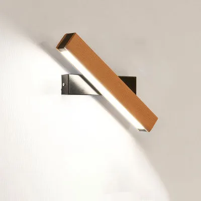 Modern wooden LED wall lamp with adjustable light bar in black finish illuminating room