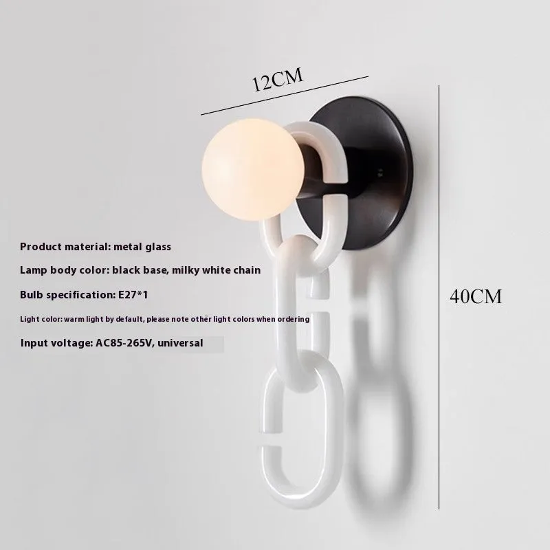 Simple glass ball bedroom wall lamp with black base and milky white chain, warm LED light