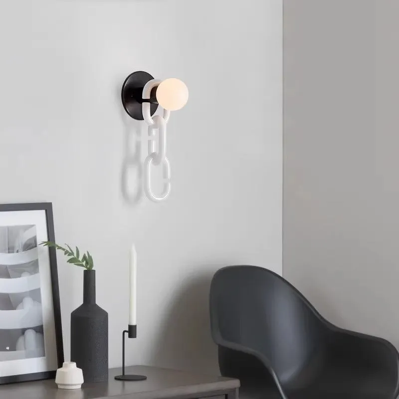 Simple glass ball bedroom wall lamp with black base and milky white chain, warm LED light