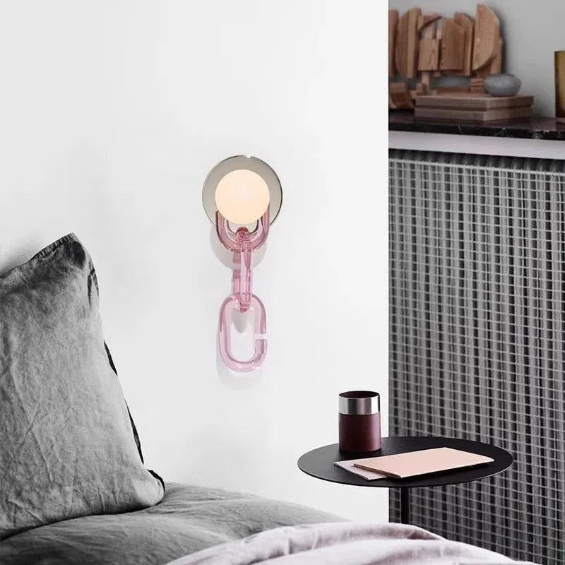 Simple glass ball bedroom wall lamp with black base and milky white chain, warm LED light