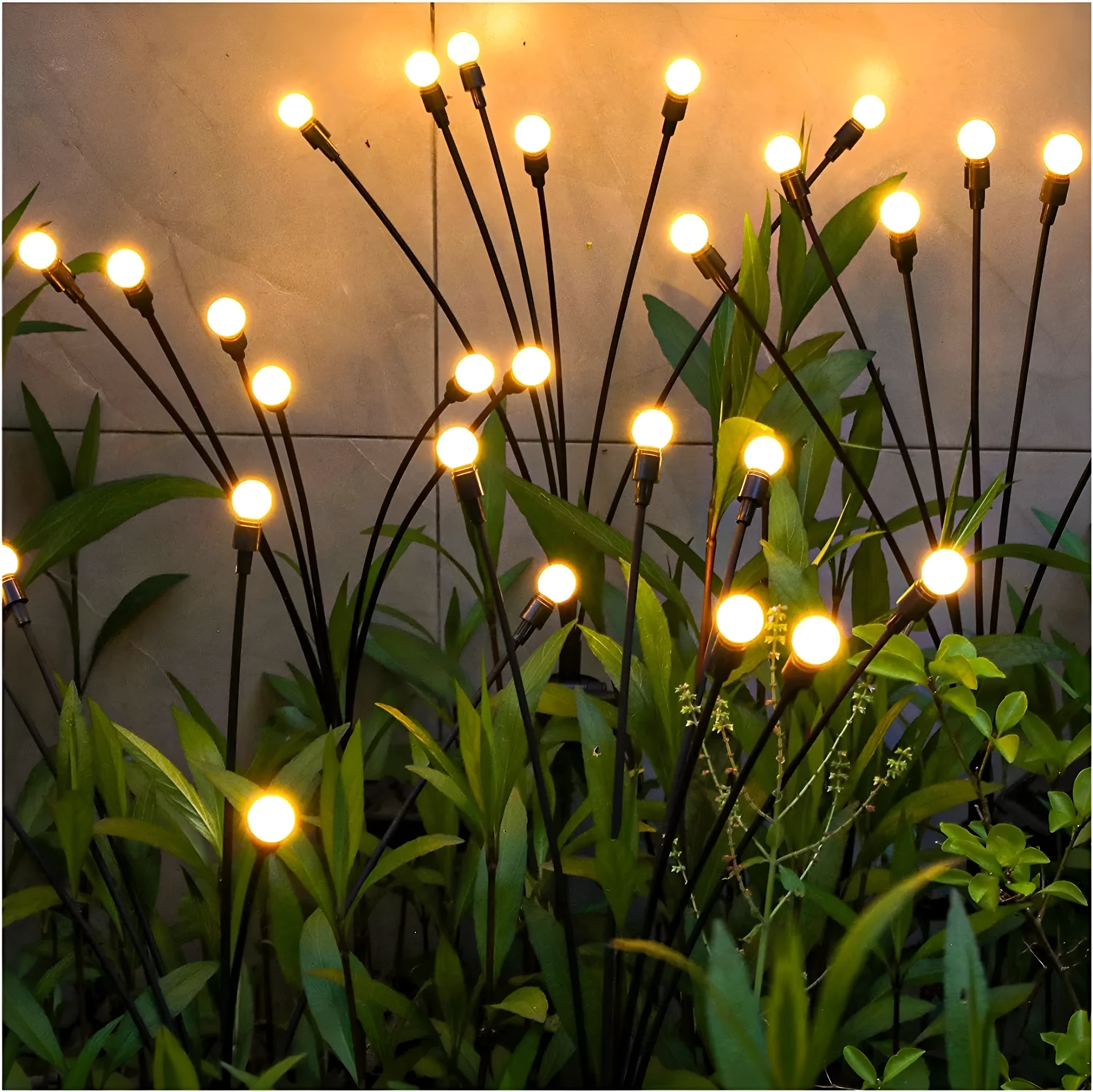 Solar-powered LED firefly garden spike light with multiple heads and a press-in ground plug on grass.