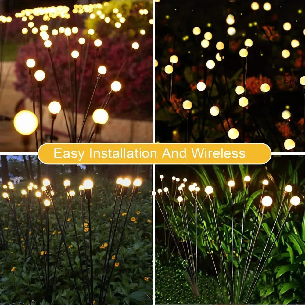 Solar-powered LED firefly garden spike light with multiple heads and a press-in ground plug on grass.