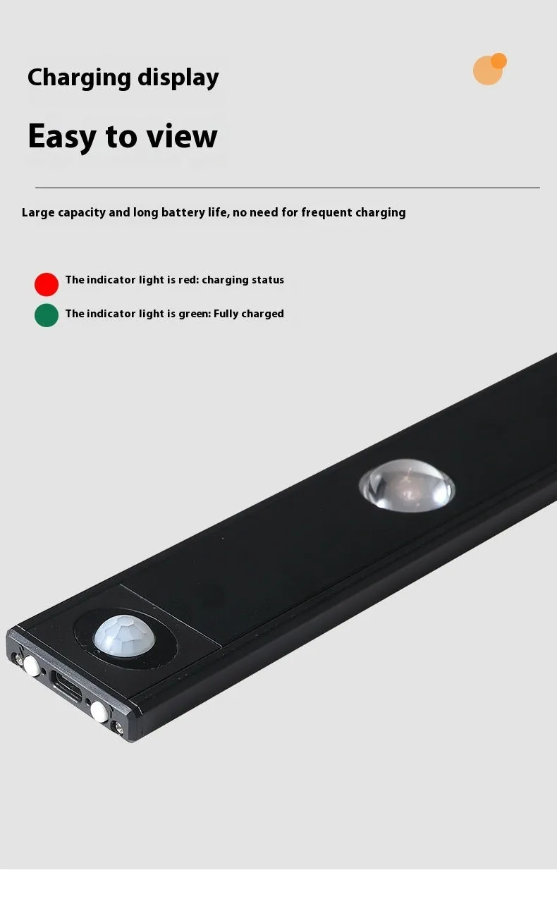 Black geometric cat's eye infrared sensor lamp with three colour light on a cabinet shelf