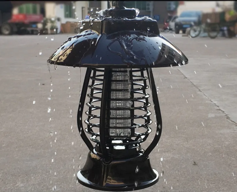 White and black solar-powered outdoor mosquito lamp with solar panel on top and LED light body.