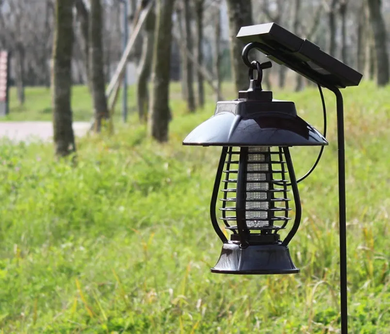 White and black solar-powered outdoor mosquito lamp with solar panel on top and LED light body.
