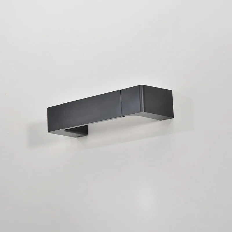 Modern minimalist wall lamp with aluminium shade in gold finish against a white wall