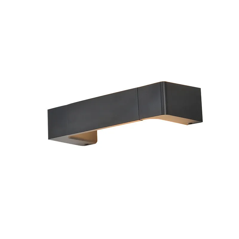 Modern minimalist wall lamp with aluminium shade in gold finish against a white wall