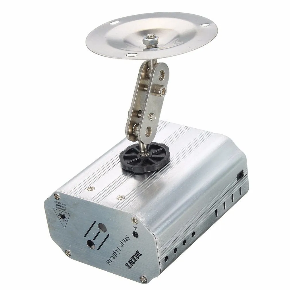JC-24 dual laser light emitting red and green patterns against a dark indoor background with voice control remote included