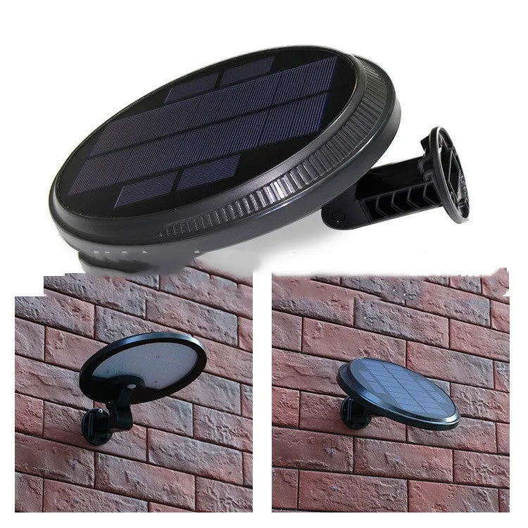 Black outdoor solar wall light with LED panel on a brick wall, IP65 waterproof garden lighting