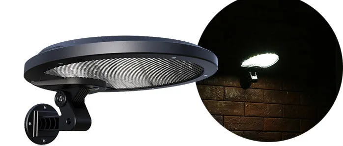 Black outdoor solar wall light with LED panel on a brick wall, IP65 waterproof garden lighting