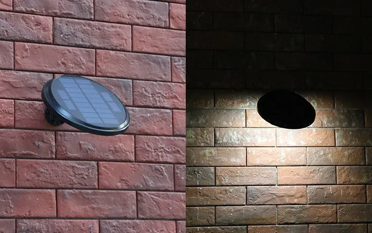 Black outdoor solar wall light with LED panel on a brick wall, IP65 waterproof garden lighting
