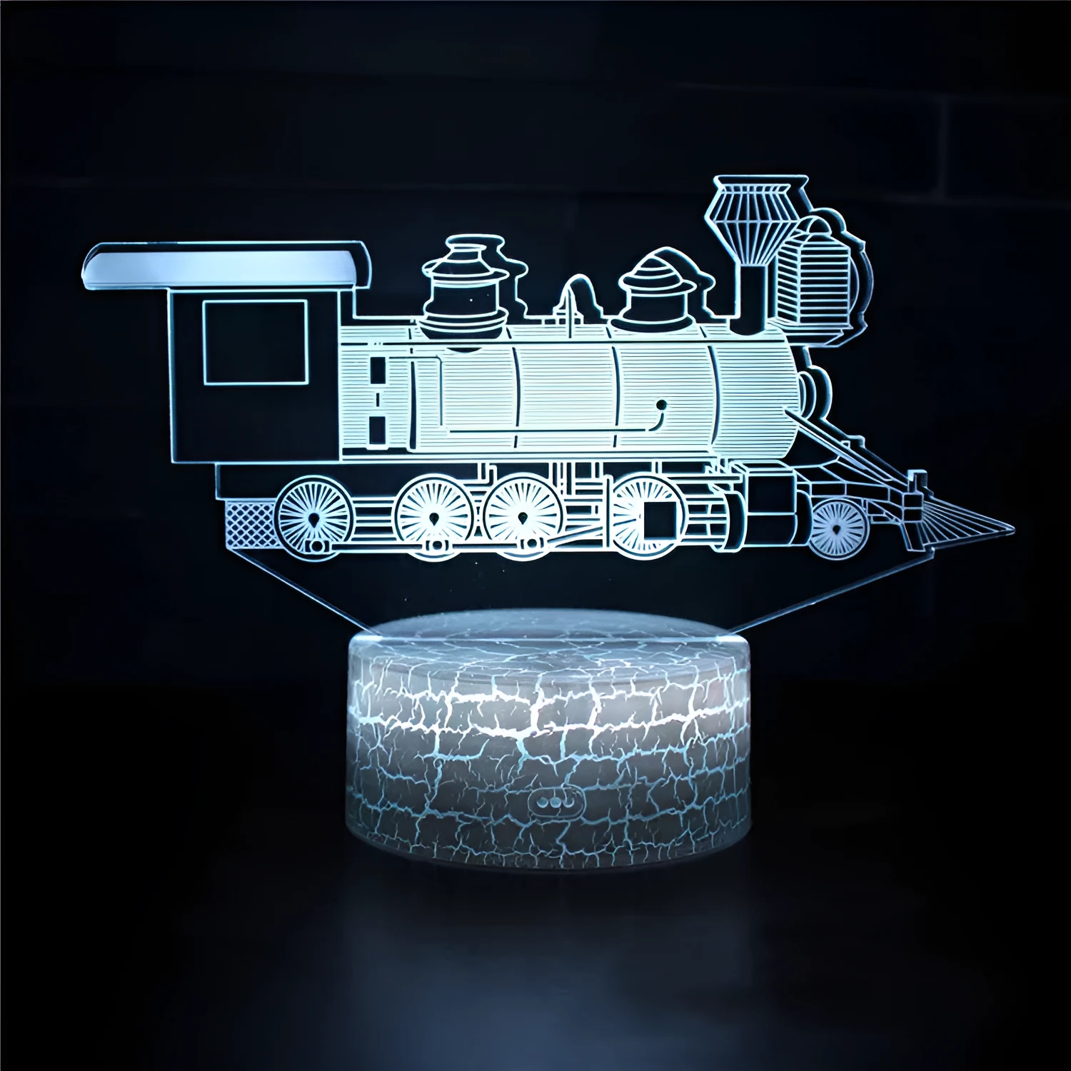 3D table lamp showing train design with black base, acrylic shade, and colourful LED glow