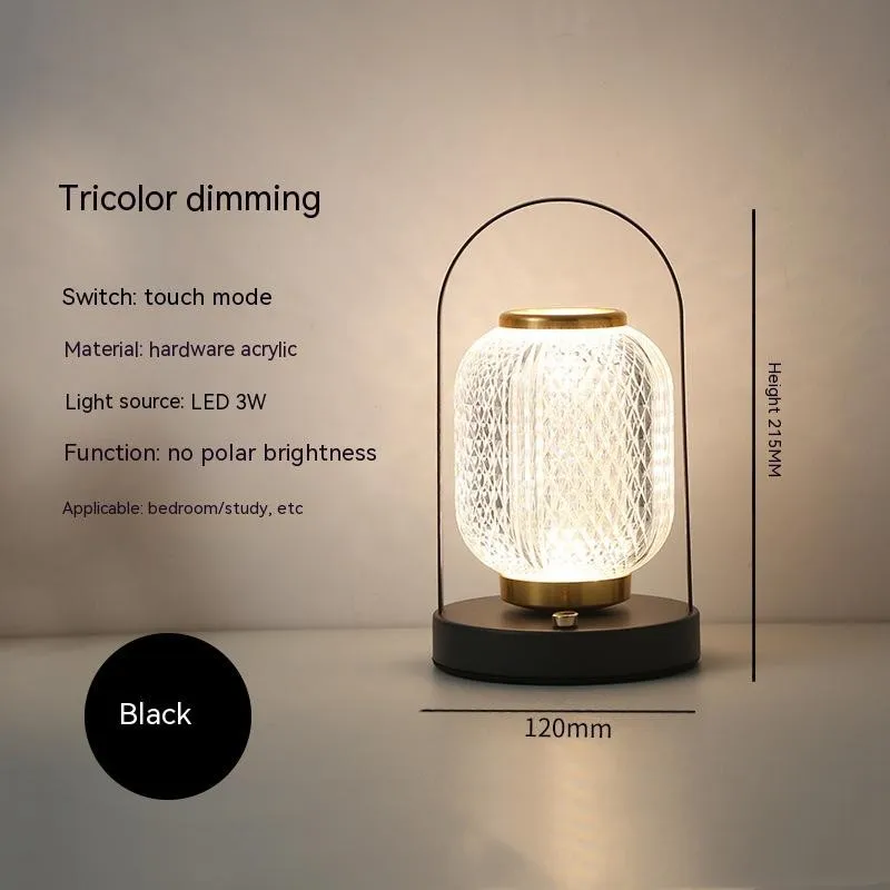 Portable black metal and acrylic LED table lamp with touch dimmer, USB rechargeable, 3W, on a camping table