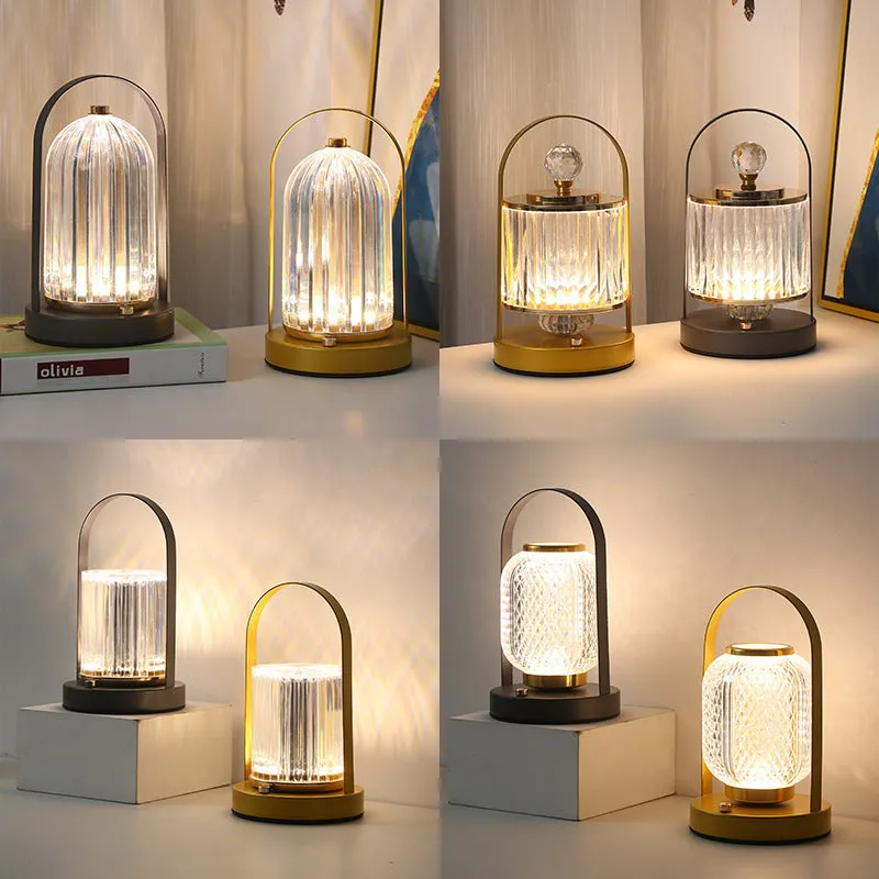 Portable black metal and acrylic LED table lamp with touch dimmer, USB rechargeable, 3W, on a camping table