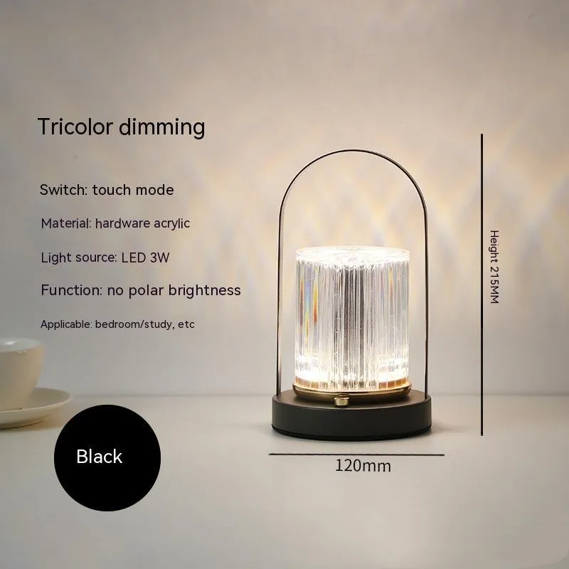 Portable black metal and acrylic LED table lamp with touch dimmer, USB rechargeable, 3W, on a camping table