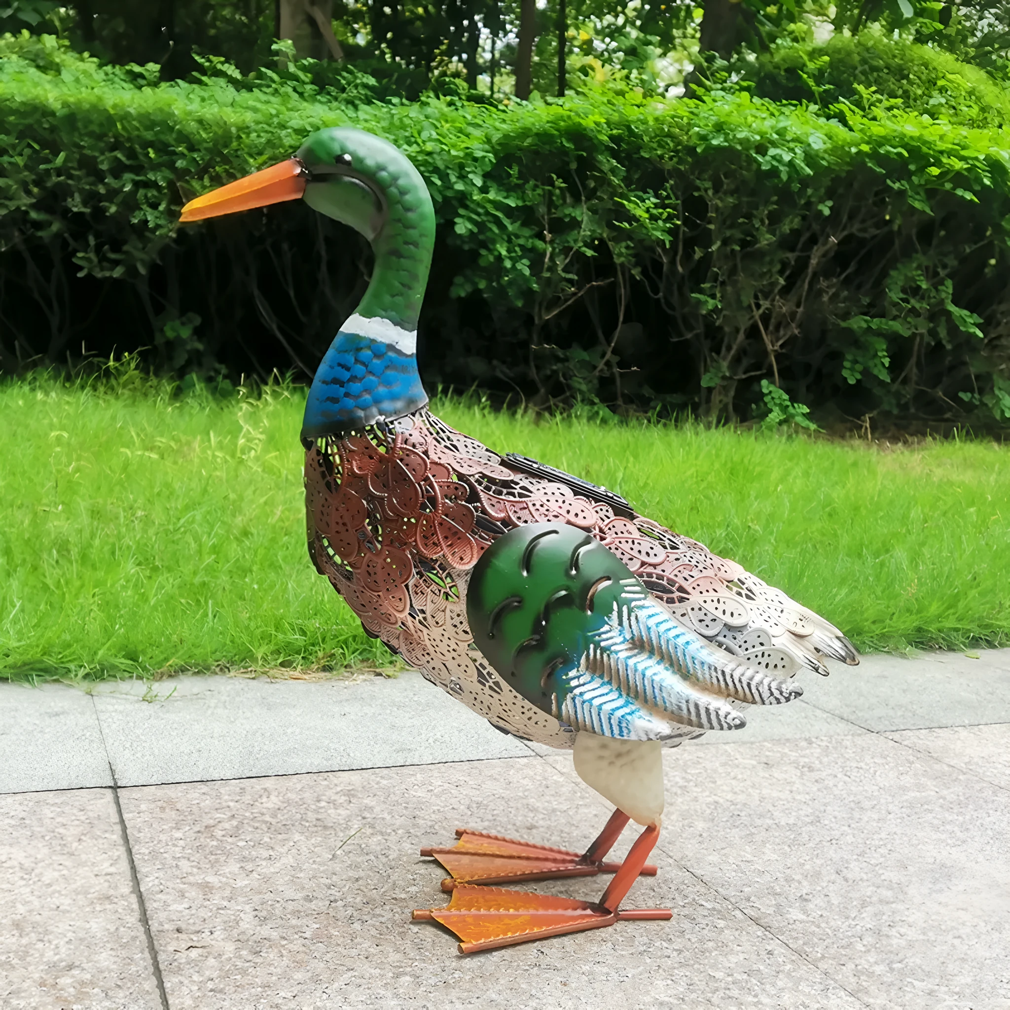 Solar powered duck-shaped wrought iron garden light with warm white LED on lawn