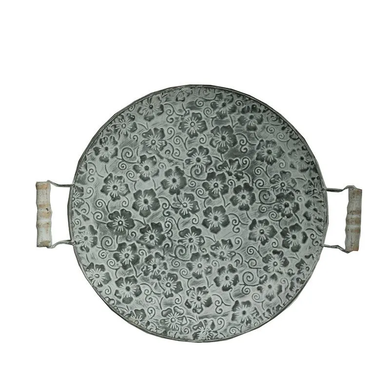 Round wrought iron storage tray in two sizes for organising jewellery or food on a countertop.