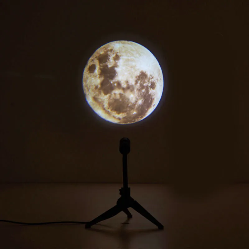 2 in 1 Earth and Moon star projector lamp with adjustable hose bracket on a table