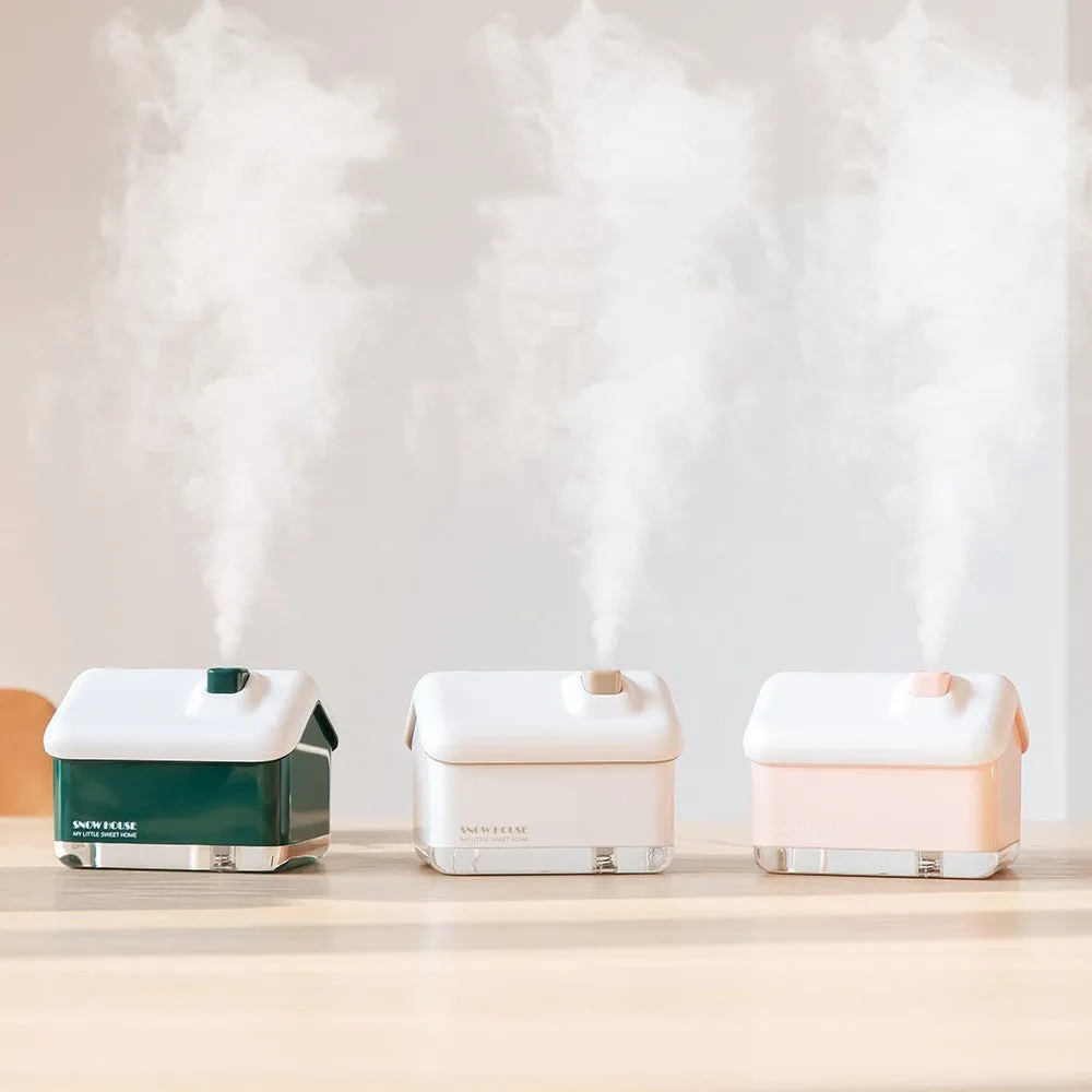 Mini igloo air humidifier in snow house shape with USB cable on desk