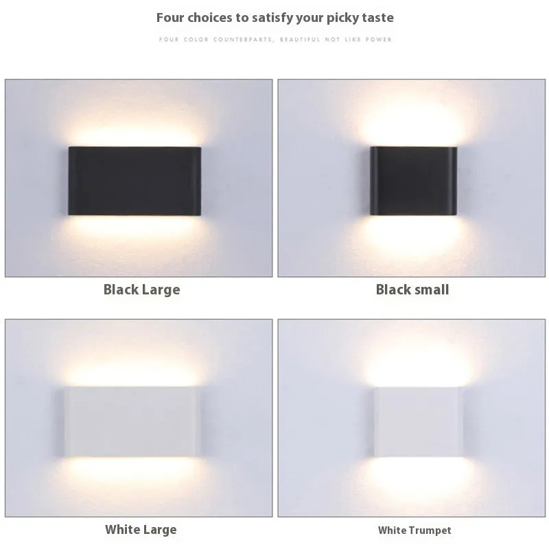 Rectangular LED outdoor wall lamp in black finish with warm light on a brick courtyard wall