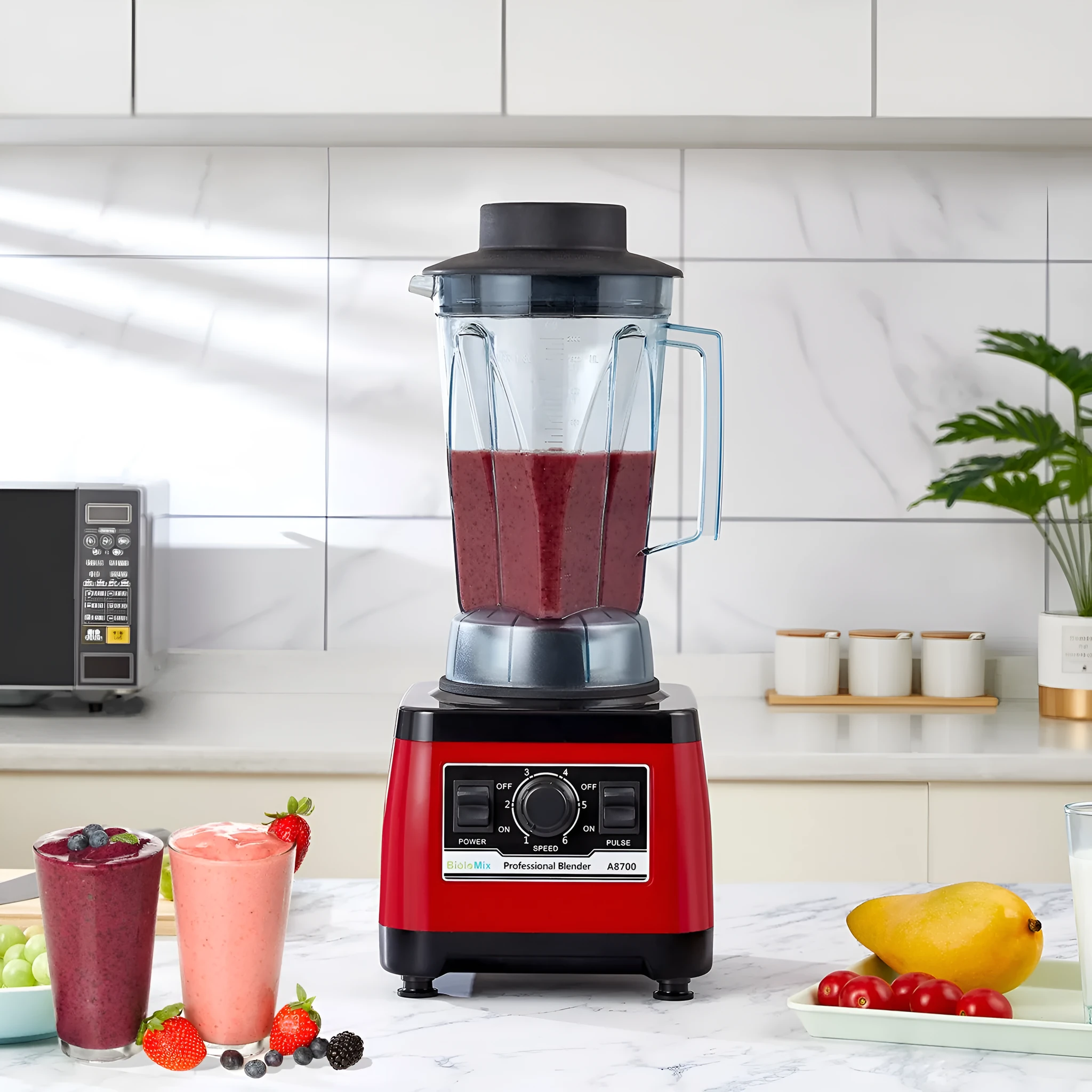 Red commercial blender with stainless steel jug and 2200W motor power for professional kitchen use