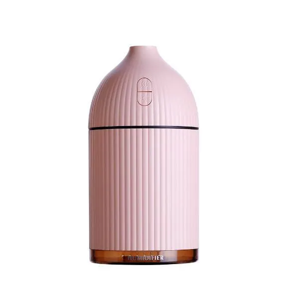 White USB-powered ultrasonic aromatherapy diffuser and humidifier with LED light on a wooden surface.