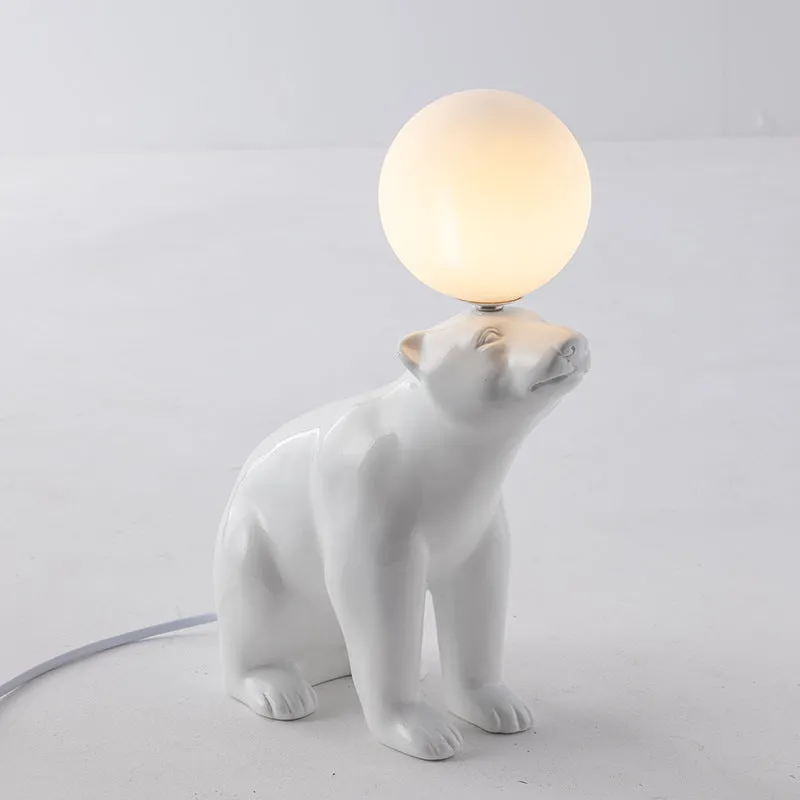 White Nordic style bear table lamp in sitting posture on a bedside table