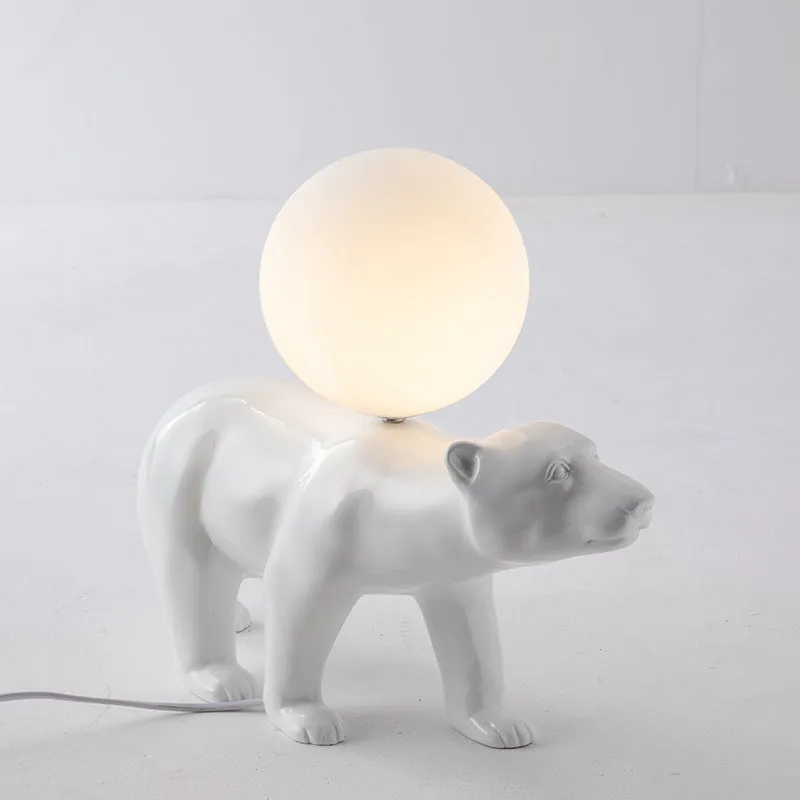 White Nordic style bear table lamp in sitting posture on a bedside table