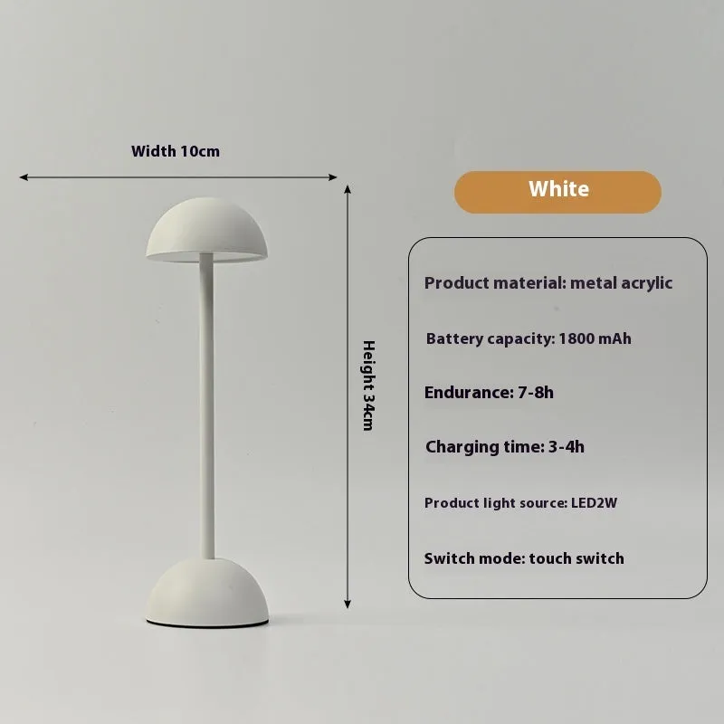 Metal mushroom table lamp in high foot design with white finish on a bar table