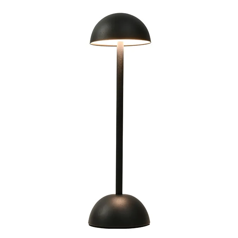 Metal mushroom table lamp in high foot design with white finish on a bar table