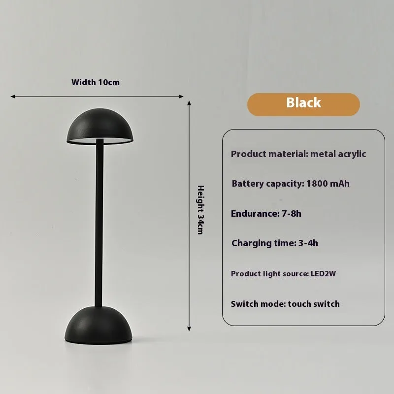 Metal mushroom table lamp in high foot design with white finish on a bar table
