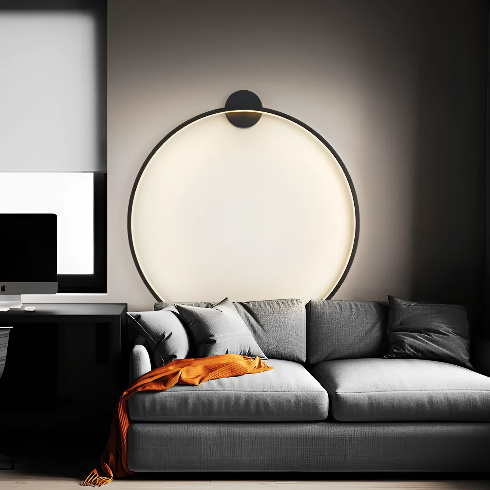 Minimalist black ring wall lamp with acrylic shade mounted on a bedroom wall